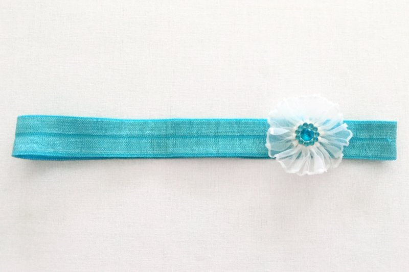 Stirnband/ Haarband weisse Blume auf türkis